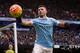 Manchester City's Argentinian striker Sergio Aguero retrieves the ball during the English Premier League football match between Manchester City and Leicester City at the Etihad Stadium in Manchester, north west England, on February 6, 2016. / AFP / OLI S