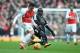 LONDON, ENGLAND - FEBRUARY 14: Alexis Sanchez of Arsenal takes on N'golo Kante of Leicester City during the Barclays Premier League match between Arsenal and Leicester City at the Emirates Stadium. (Photo by Michael Regan/Getty Images)