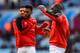 BIRMINGHAM, ENGLAND - FEBRUARY 14: Daniel Sturridge of Liverpool stretches with Emre Can and Mamadou Sakho of Liverpool during the warm-up before the Barclays Premier League match between Aston Villa and Liverpool at Villa Park on February 14, 2016 in Bi