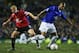 Bent takes on Manchester United's Paul Scholes in 2005.