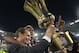 Juventus' coach Massimiliano Allegri (L) and Juventus' midfielder from France Paul Pogba celebrate with the trophy after winning 2-1 the Italian Tim Cup final match (Coppa Italia) between Juventus and Lazio on May 20, 2015 at the Stadio Olimpico in Rome.