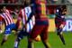 Barcelona's Argentinian forward Lionel Messi (R) kicks the ball to score a goal during the Spanish league football match Real Sporting de Gijon vs FC Barcelona at El Molinon stadium in Gijonon 2016. AFP PHOTO / MIGUEL RIOPA / AFP / MIGUEL RIOPA (P