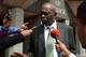 Former FIFA vice-president Jack Warner talks with journalists outside the Hall of Justice in Port-of-Spain, Trinidad, on December 4, 2015, following the hearing of his legal challenge to avert being extradited to the United States where he has been indict