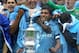 LONDON, ENGLAND - MAY 14: Carlos Tevez of Manchester City and his team mates celebrate with the trophy after they won the FA Cup sponsored by E.ON Final match between Manchester City and Stoke City at Wembley Stadium on May 14, 2011 in London, England.