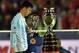 Argentina's forward Lionel Messi walks with the second place medal of the 2015 Copa America football championship, in Santiago, Chile, on July 4, 2015. Chile defeated Argentina 4-1 in the penalty shootout. AFP PHOTO / RODRIGO ARANGUA (Photo credi