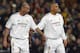MADRID, Spain: Real Madrid's French midfielder Zinedine Zidane and his teammate Ronaldo congratulate each other after a goal during their Champions League quarter-final first leg football match against Monaco, 24 March 2004 at the Santiago Bernabeu stadi