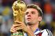 RIO DE JANEIRO, BRAZIL - JULY 13: Thomas Mueller of Germany celebrates with the World Cup trophy after defeating Argentina 1-0 in extra time during the 2014 FIFA World Cup Brazil Final match between Germany and Argentina at Maracana on July 13, 2014 in