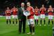 Manchester United's English striker Wayne Rooney receives an award from former Manchester United player Sir Bobby Charlton before playing in his 500th game for his club in the English Premier League football match between Manchester United and Norwich Cit