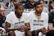 SAN ANTONIO, TX - OCTOBER 18: Kawhi Leonard #2 of the San Antonio Spurs and Tim Duncan #21 of the San Antonio Spurs sit on the bench against the Detroit Pistons during a preseason game on October 18, 2015 at the AT&T Center in San Antonio, Texas. NOTE TO