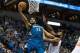 Feb 20, 2016; Minneapolis, MN, USA; Minnesota Timberwolves center Karl-Anthony Towns (32) shoots and is fouled by New York Knicks forward Kyle O'Quinn (9) during the fourth quarter at Target Center. Mandatory Credit: Brace Hemmelgarn-USA TODAY Sports