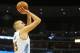 Dec 8, 2015; Denver, CO, USA; Denver Nuggets center Nikola Jokic (15) shoots the ball during the first half against the Orlando Magic at Pepsi Center. Mandatory Credit: Chris Humphreys-USA TODAY Sports