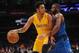 January 26, 2016; Los Angeles, CA, USA; Los Angeles Lakers guard D'Angelo Russell (1) moves the ball against Dallas Mavericks guard Wesley Matthews (23) during the second half at Staples Center. Mandatory Credit: Gary A. Vasquez-USA TODAY Sports
