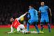 LONDON, ENGLAND - FEBRUARY 23: Olivier Giroud of Arsenal goes down under the tackle from Neymar of Barcelona during the UEFA Champions League round of 16, first leg match between Arsenal FC and FC Barcelona at the Emirates Stadium on February 23, 2016 in