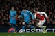 Arsenal's Spanish defender Nacho Monreal (R) vies with Barcelona's Argentinian forward Lionel Messi during the UEFA Champions League round of 16 1st leg football match between Arsenal and Barcelona at the Emirates Stadium in London on February 23, 2016.