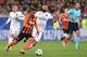 Shakhtar Donetsk's Brazilian midfielder Alex Teixeira (L) vies with Paris Saint-Germain's Italian midfielder Thiago Motta during the UEFA Champions League group A football match between Shakhtar Donetsk and Paris Saint-Germain at the Arena Lviv, in the Uk