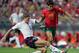 LISBON, Portugal: Portugal's midfielder Deco (R) fights for the ball with England midfielder Steven Gerrard, 24 June 2004 during their European Nations Championship quarter-final football match between Portugal and England at the Estadio Da Luz in Lisbon
