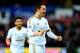Gylfi Sigurdsson celebrates scoring a free-kick in Swansea's recent draw with Crystal Palace. His goals have been vital to them keeping their heads above the relegation zone.