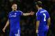 WATFORD, ENGLAND - FEBRUARY 03: John Terry of Chelsea speaks with Branislav Ivanovic of Chelsea during the Barclays Premier League match between Watford and Chelsea at Vicarage Road on February 3, 2016 in Watford, England. (Photo by Clive Mason/Getty Im