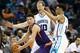 CHARLOTTE, NC - MARCH 01: Devin Booker #1 of the Phoenix Suns is trapped by teammates Cody Zeller #40 and Courtney Lee #1 of the Charlotte Hornets during their game at Time Warner Cable Arena on March 1, 2016 in Charlotte, North Carolina. NOTE TO USER: