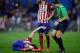 MADRID, SPAIN - NOVEMBER 28: Tiago Mendes of Club Atletico de Madrid lies injured beside Juanfran during the La Liga match between Club Atletico de Madrid and Real CD Espanyol at Vicente Calderon Stadium on November 28, 2015 in Madrid, Spain. (Photo by