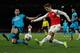 Arsenal's Spanish defender Nacho Monreal(R) crosses the ball past Barcelona's midfielder Sergio Busquets during the UEFA Champions League round of 16 1st leg football match between Arsenal and Barcelona at the Emirates Stadium in London on February 23, 20