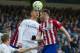Real Madrid's Portuguese forward Cristiano Ronaldo (L) vies with Atletico Madrid's midfielder Saul Niguez during the Spanish league football match Real Madrid CF vs Club Atletico de Madrid at the Santiago Bernabeu stadium in Madrid on February 27, 2016. /