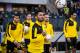 Dortmund's midfielder Ilkay Guendogan (C ) and team mates walk onto the pitch prior to the German first division Bundesliga football match, Hertha Berlin v Borussia Dortmund, at the Olympic stadium in Berlin on February 6, 2016. / AFP / ODD ANDERSEN / RE
