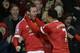 Manchester United's Spanish midfielder Juan Mata (L) celebrates scoring the opening goal with Manchester United's Dutch midfielder Memphis Depay (R) during the English Premier League football match between Manchester United and Watford at Old Trafford in