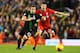 LIVERPOOL, ENGLAND - JANUARY 26: Xherdan Shaqiri of Stoke City and Jon Flanagan of Liverpool chase the ball during the Capital One Cup semi final second leg match between Liverpool and Stoke City at Anfield on January 26, 2016 in Liverpool, England. (Ph