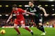 LIVERPOOL, ENGLAND - JANUARY 26: Jon Flanagan of Liverpool holds off Marko Arnautovic of Stoke City during the Capital One Cup semi final second leg match between Liverpool and Stoke City at Anfield on January 26, 2016 in Liverpool, England. (Photo by C