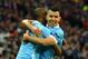 Manchester City's Brazilian midfielder Fernandinho (L) celebrates with Manchester City's Argentinian striker Sergio Aguero after scoring the opening goal of the English League Cup final football match between Liverpool and Manchester City at Wembley Stadi