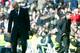 Real Madrid's French coach Zinedine Zidane (L) looks down next to Atletico Madrid's Argentinian coach Diego Simeone during the Spanish league football match Real Madrid CF vs Club Atletico de Madrid at the Santiago Bernabeu stadium in Madrid on February 2
