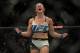 LAS VEGAS, NV - MARCH 5: Miesha Tate celebrates her submission victory over Holly Holm after their women's bantamweight championship bout during the UFC 196 in the MGM Grand Garden Arena on March 5, 2016 in Las Vegas, Nevada. (Photo by Brandon Magnus/Z
