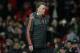 Manchester United's Dutch manager Louis van Gaal leaves the pitch following the UEFA Europa League round of 32, second leg football match between Manchester United and and FC Midtjylland at Old Trafford in Manchester, north west England, on February 25, 2