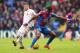 LONDON, ENGLAND - MARCH 06: Wilfried Zaha of Crystal Palace holds off Alberto Moreno of Liverpool during the Barclays Premier League match between Crystal Palace and Liverpool at Selhurst Park on March 6, 2016 in London, England. (Photo by Paul Gilham/G