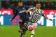 MILAN, ITALY - MARCH 02: Gary Alexis Medel of FC Internazionale Milano is challenged by Stefano Sturaro of Juventus FC during the TIM Cup match between FC Internazionale Milano and Juventus FC at Stadio Giuseppe Meazza on March 2, 2016 in Milan, Italy.