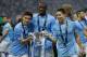 Manchester City's Spanish midfielder Jesus Navas (L), Manchester City's Ivorian midfielder Yaya Toure (C) and Manchester City's French midfielder Samir Nasri (R) pose with the League Cup after Manchester City won the League Cup final football match agains
