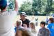After delivering lunches to a local Lexington, Kentucky, elementary school, Lee and his Kentucky teammates played kickball with kids from the school.
