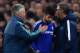LONDON, ENGLAND - MARCH 09: The injured Diego Costa of Chelsea is consoled by Head Coach Laurent Blanc (L) of PSG and Guus Hiddink (R) interim manager of Chelsea as he leaves the pitch during the UEFA Champions League round of 16, second leg match betwee