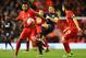 LIVERPOOL, ENGLAND - JANUARY 30: Aaron Cresswell of West Ham United battles with Jerome Sinclair (L) and Joe Allen of Liverpool during the Emirates FA Cup Fourth Round match between Liverpool and West Ham United at Anfield on January 30, 2016 in Liverpoo