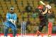 Hong Kong's Ryan Campbell(R)is watched by Afghanistan's wicketkeeper Mohammad Shahzad as he plays a shot during the World T20 cricket tournament match between Afghanistan and Hong Kong at The Vidarbha Cricket Association Stadium in Nagpur on March 10, 201