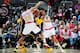 ATLANTA, GA - MARCH 13: Paul George #13 of the Indiana Pacers defends the abll against Kent Bazemore #24 of the Atlanta Hawks during the game on March 13, 2016 at Philips Arena in Atlanta, Georgia. NOTE TO USER: User expressly acknowledges and agrees tha