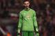 Manchester United's Spanish goalkeeper David de Gea reacts during the UEFA Europa League round of 16, first leg football match between Liverpool and Manchester United at Anfield in Liverpool, northwest England on March 10, 2016. / AFP / PAUL ELLIS