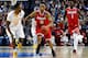 PORTLAND, OR - MARCH 19: D'Angelo Russell #0 of the Ohio State Buckeyes dribbles past Treveon Graham #21 of the Virginia Commonwealth Rams in the first half during the second round of the 2015 NCAA Men's Basketball Tournament at Moda Center on March 19,