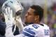 ORCHARD PARK, NY - DECEMBER 27: Greg Hardy #76 of the Dallas Cowboys puts on his helmet on the sideline against the Buffalo Bills during NFL game action at Ralph Wilson Stadium on December 27, 2015 in Orchard Park, New York. (Photo by Tom Szczerbowski/Get