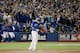 TORONTO, ON - OCTOBER 14: Jose Bautista #19 of the Toronto Blue Jays flips his bat up in the air after he hits a three-run home run in the seventh inning against the Texas Rangers in game five of the American League Division Series at Rogers Centre on Oc