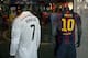 Two store mannequins sport the jerseys of Real Madrid's Portuguese forward Ronaldo Cristiano (L) and Barcelona's Argentinian forward Lionel Messi in a shop window at Puerta del Sol, in the centre of Madrid on October 23, 2014. Real Madrid meet Barcelona f