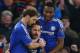 LONDON, ENGLAND - JANUARY 16: Cesc Fabregas (C) of Chelsea celebrates scoring his team's second goal with his team mates Branislav Ivanovic (L) and John Mikel Obi (R) of Chelsea during the Barclays Premier League match between Chelsea and Everton at Stamf