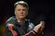 Manchester United's Dutch manager Louis van Gaal applauds supporters after the UEFA Europa League round of 16, second leg football match between Manchester United and Liverpool at Old Trafford in Manchester, north west England on March 17, 2016.
The game