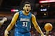 HOUSTON, TX - MARCH 18: Karl-Anthony Towns #32 of the Minnesota Timberwolves reacts to a call in front of James Harden #13 of the Houston Rockets on the court during their game at the Toyota Center on March 18, 2016 in Houston, Texas. NOTE TO USER: User